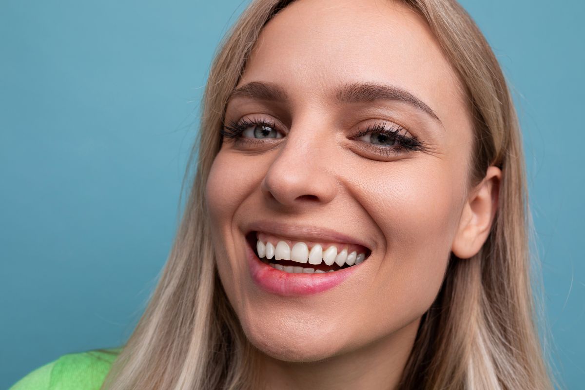 woman smiling Woman smiling with bright healthy teeth after cosmetic dentistry treatment.