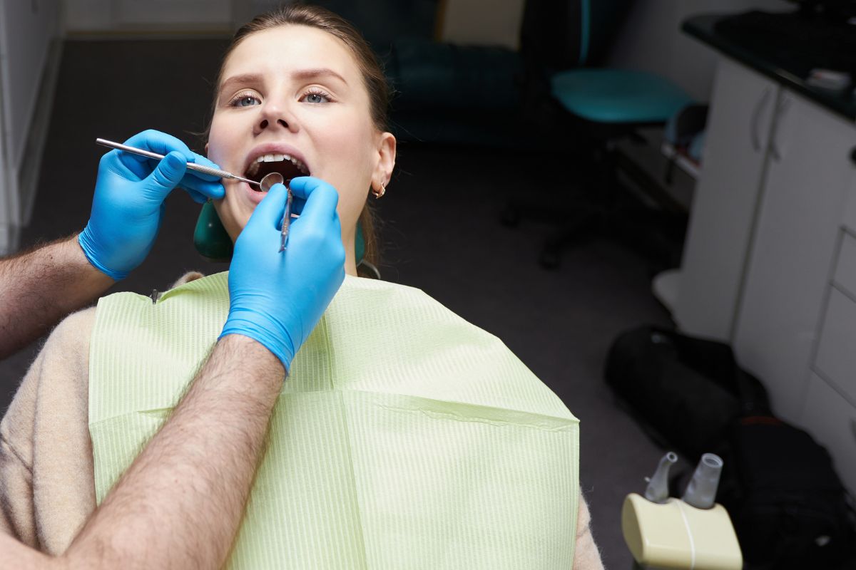 Dentist performing a gentle dental checkup.