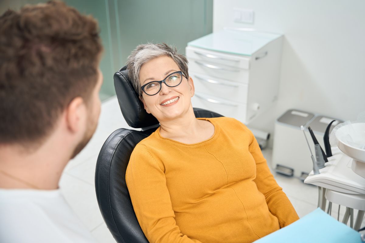 smiling dental patient A patient smiling during a cosmetic dental consultation.