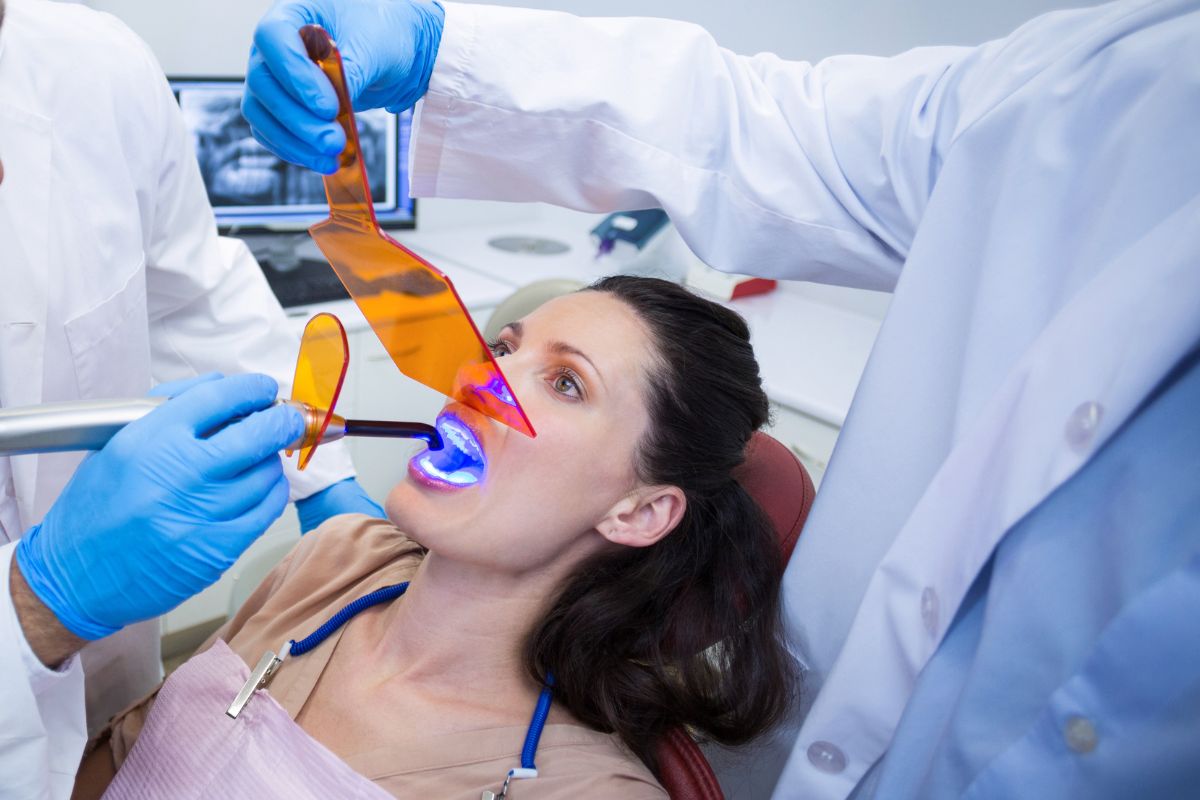 A Patient receiving professional teeth whitening treatment.